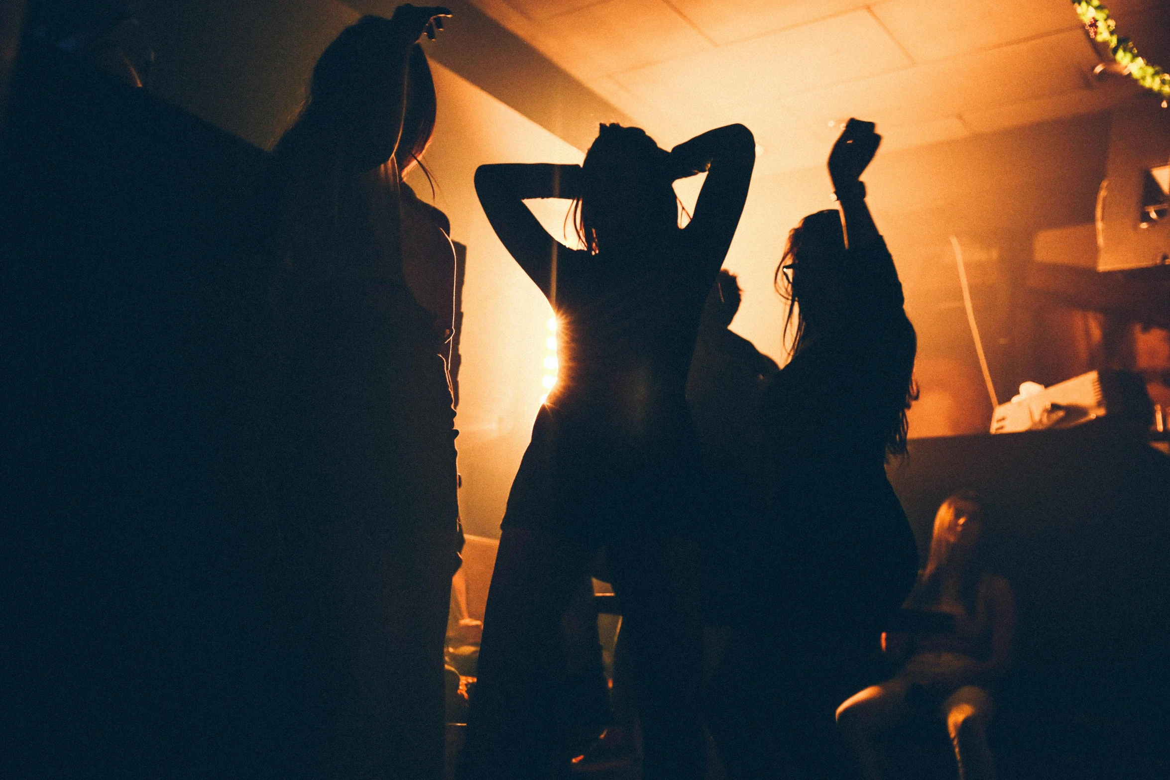 a group of people that are standing in the dark, trending on unsplash, happening, dancefloor kismet, college girls, dark hazy room, profile image