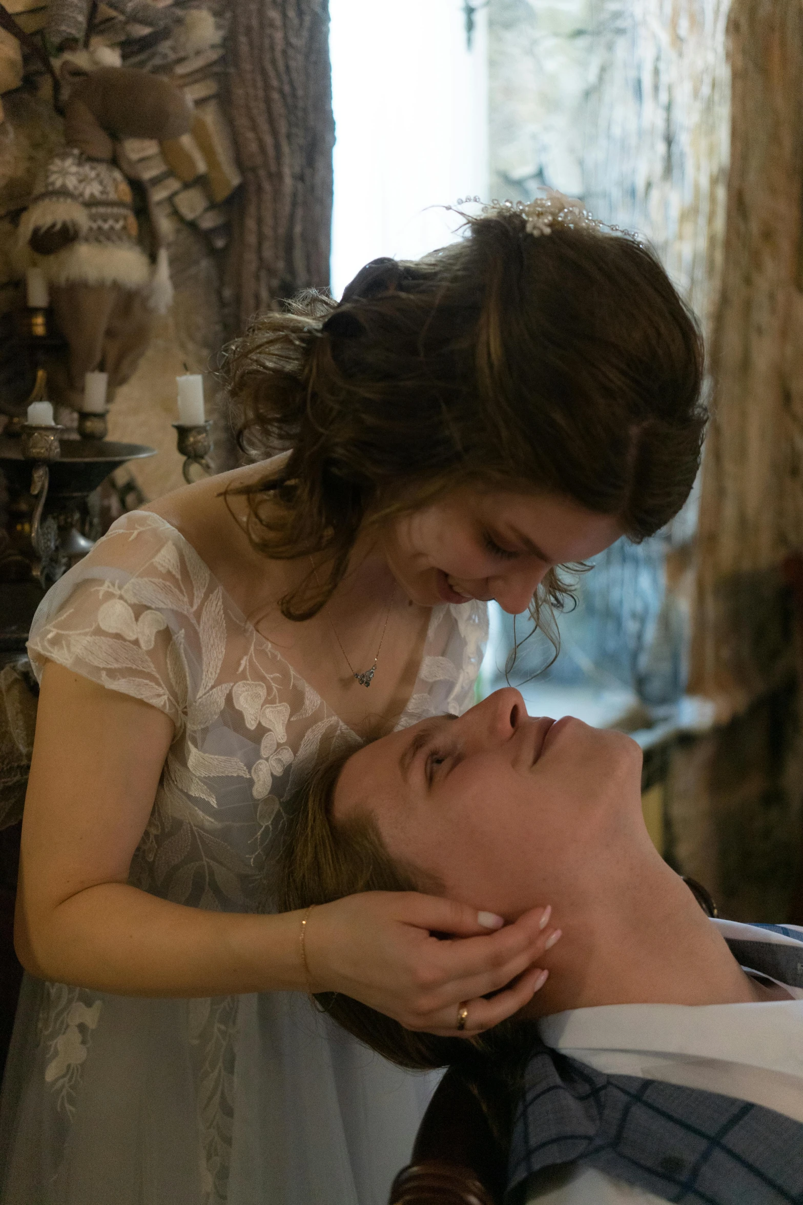 a man laying on top of a bed next to a woman, inspired by Karl Bryullov, romanticism, film still of emma watson, only head and shoulders, pale ivory skin, victorian setting