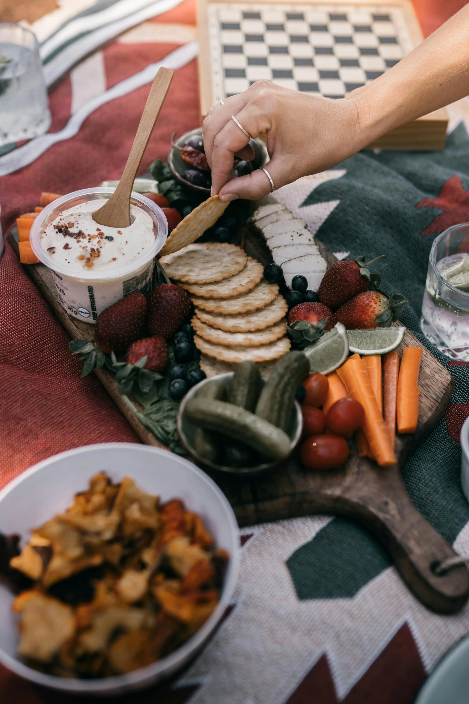 a close up of a plate of food on a table, by Carey Morris, pexels contest winner, people on a picnic, smooth texture, creamy, game board