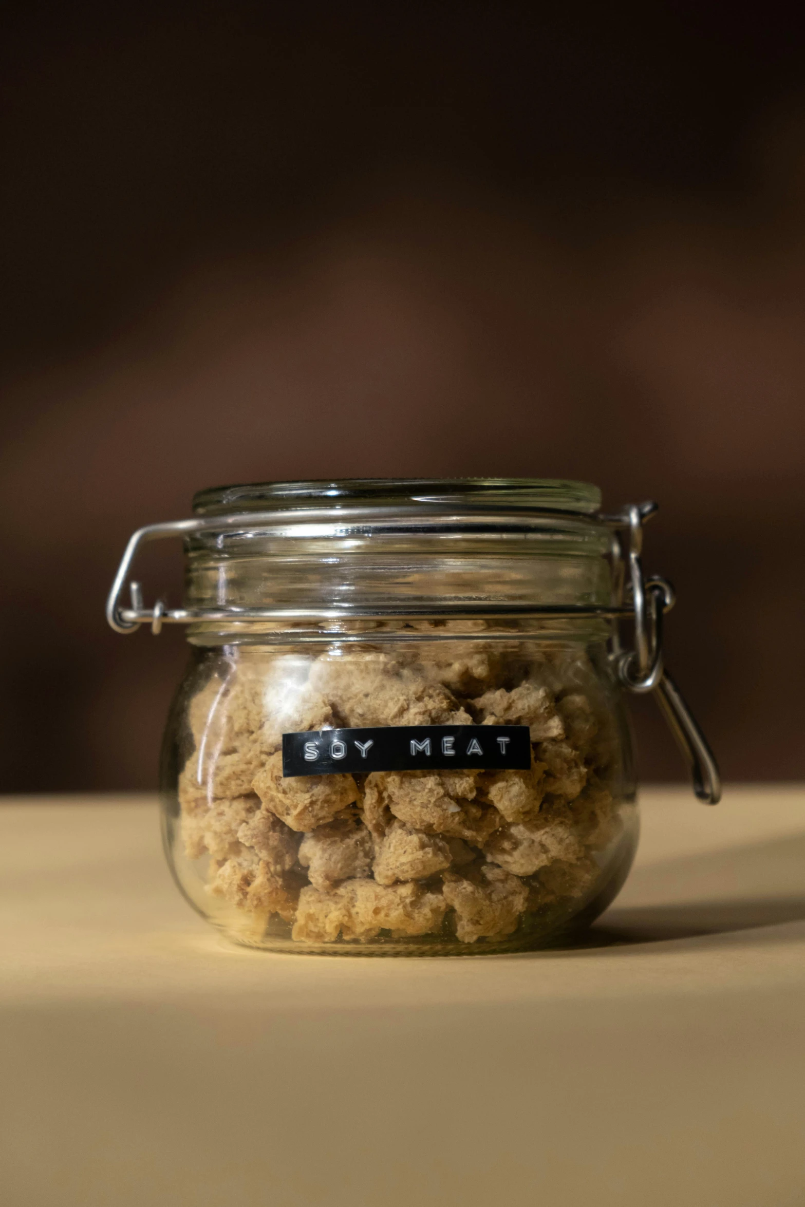 a jar of granola sitting on top of a table, chicken nuggets, detailed product image, hey buddy, dynamic angled shot