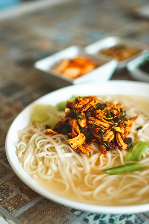 a close up of a plate of food on a table, inspired by Tan Ting-pho, pexels contest winner, dau-al-set, square, traditional korean city, 15081959 21121991 01012000 4k, chicken