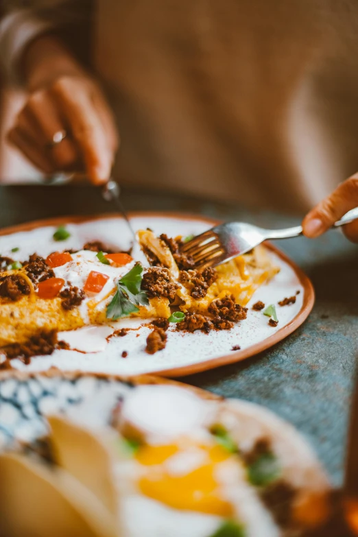 a close up of a plate of food on a table, pexels contest winner, happening, spatula, hispanic, over-shoulder shot, slim