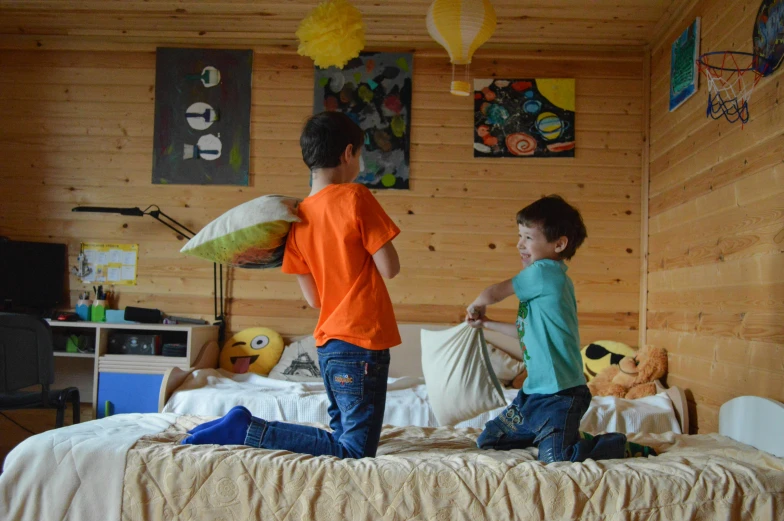 a couple of kids standing on top of a bed, by Petr Brandl, pexels contest winner, boy's room, avatar image, ecovillage, playing