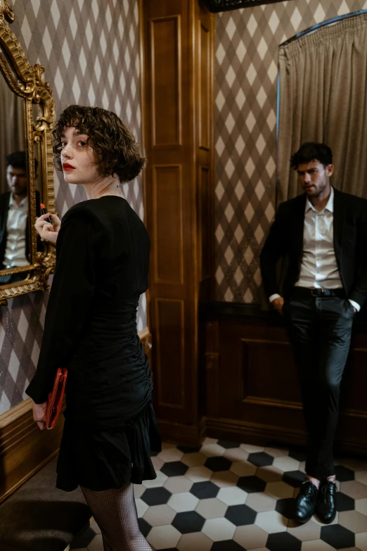 a man and a woman standing in front of a mirror, an album cover, inspired by Nan Goldin, pexels contest winner, renaissance, paris hotel style, cinematic outfit photo, ( ( theatrical ) ), woman