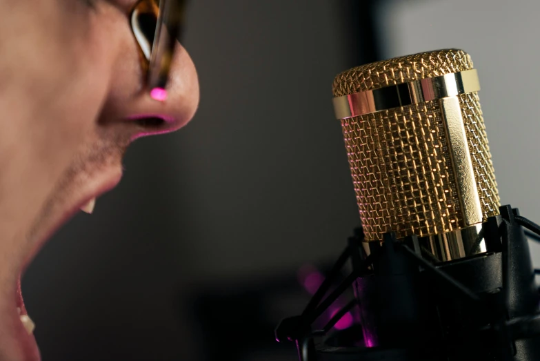 a woman singing into a microphone in a recording studio, trending on pexels, realism, wearing gold glasses, micro detailed, avatar image, close up shot from the side