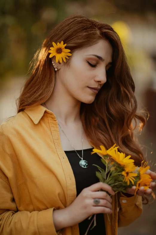 a woman holding a bunch of yellow flowers, a colorized photo, by irakli nadar, trending on pexels, wearing several pendants, maiden with copper hair, maya ali, sunny complementary palette