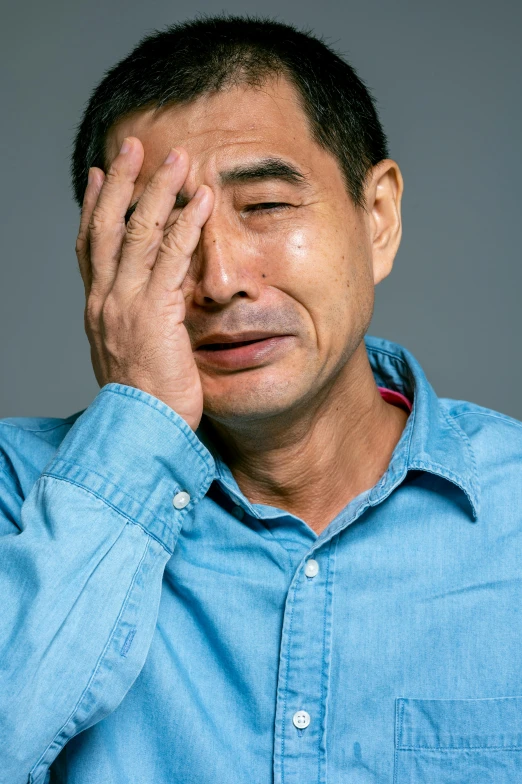 a man holding his hands to his face, by Murakami, shutterstock, shin hanga, tony hawk crying, shot in the photo studio, 'i'm so tired, taken in the late 2010s