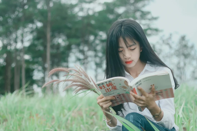 a woman sitting in a field reading a book, by Jang Seung-eop, pexels contest winner, realism, male ulzzang, avatar image, profile picture, female with long black hair