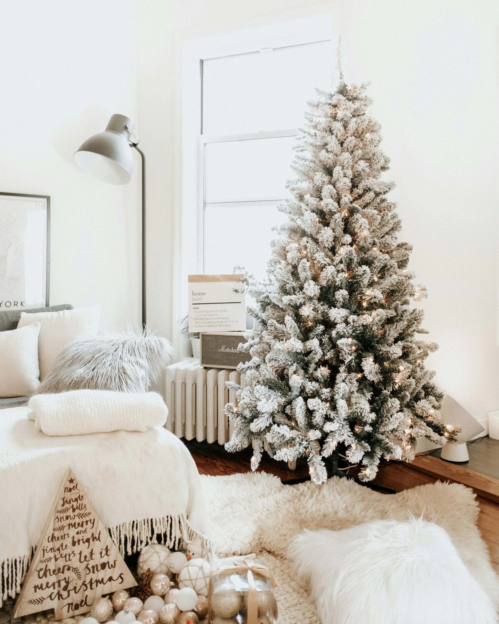 a living room filled with furniture and a christmas tree, inspired by Ernest William Christmas, unsplash contest winner, light grey fur, serene bedroom setting, thumbnail, angled shot