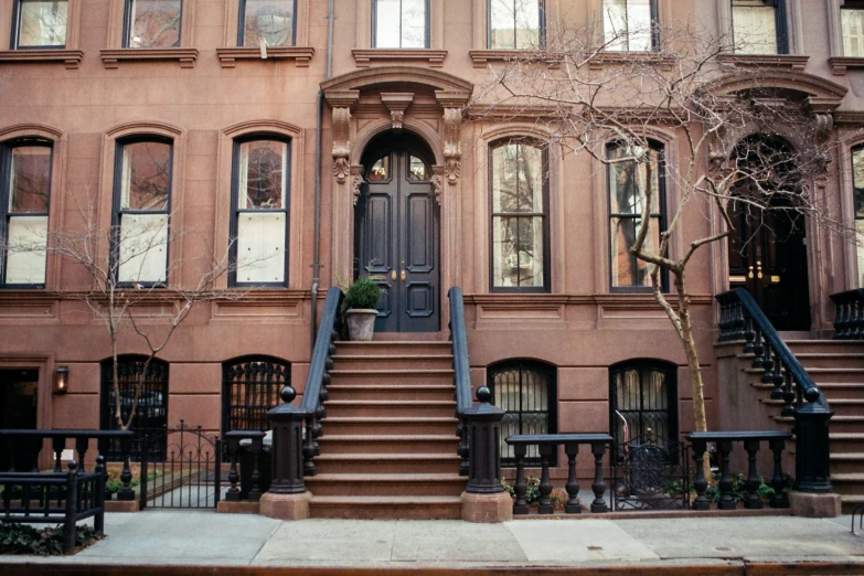 a building with a bunch of stairs in front of it, by Nina Hamnett, pexels, harlem renaissance, edward hopper filonov, victorian house, tall entry, a cozy
