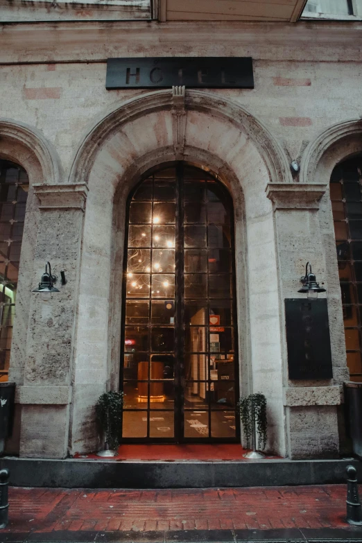 a very tall building with a bunch of windows, pexels contest winner, art nouveau, doorway, dark warm light, restaurant, instagram story