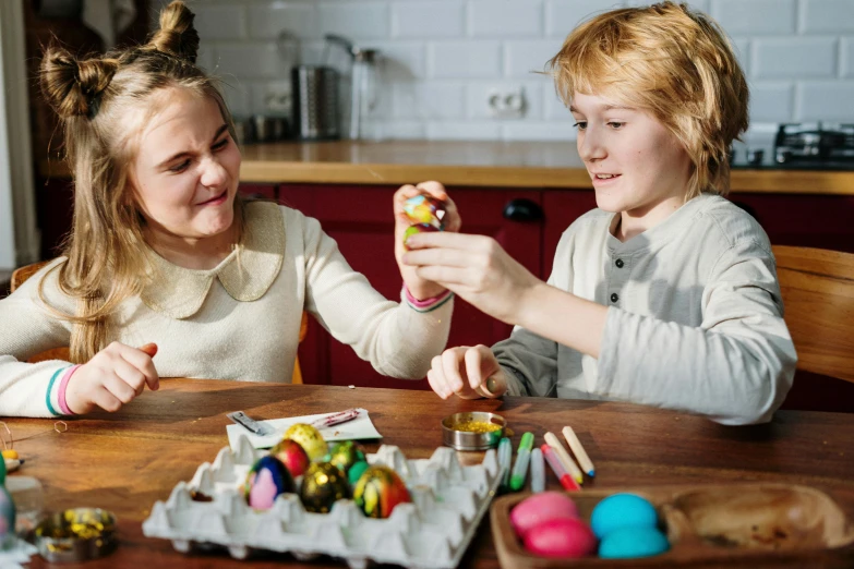 a couple of young girls sitting at a table, pexels contest winner, process art, holding easter eggs, teenage boy, 15081959 21121991 01012000 4k, thumbnail