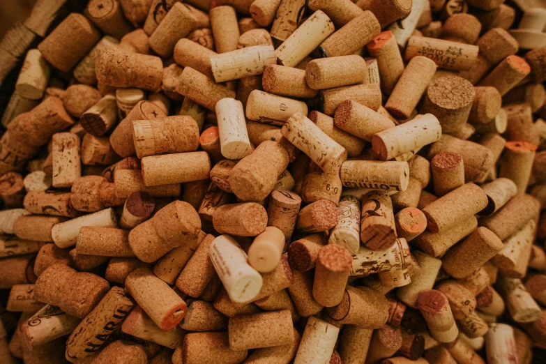 a bowl filled with lots of wine corks, pexels contest winner, graffiti, background image, high angle close up shot, thumbnail, alessio albi