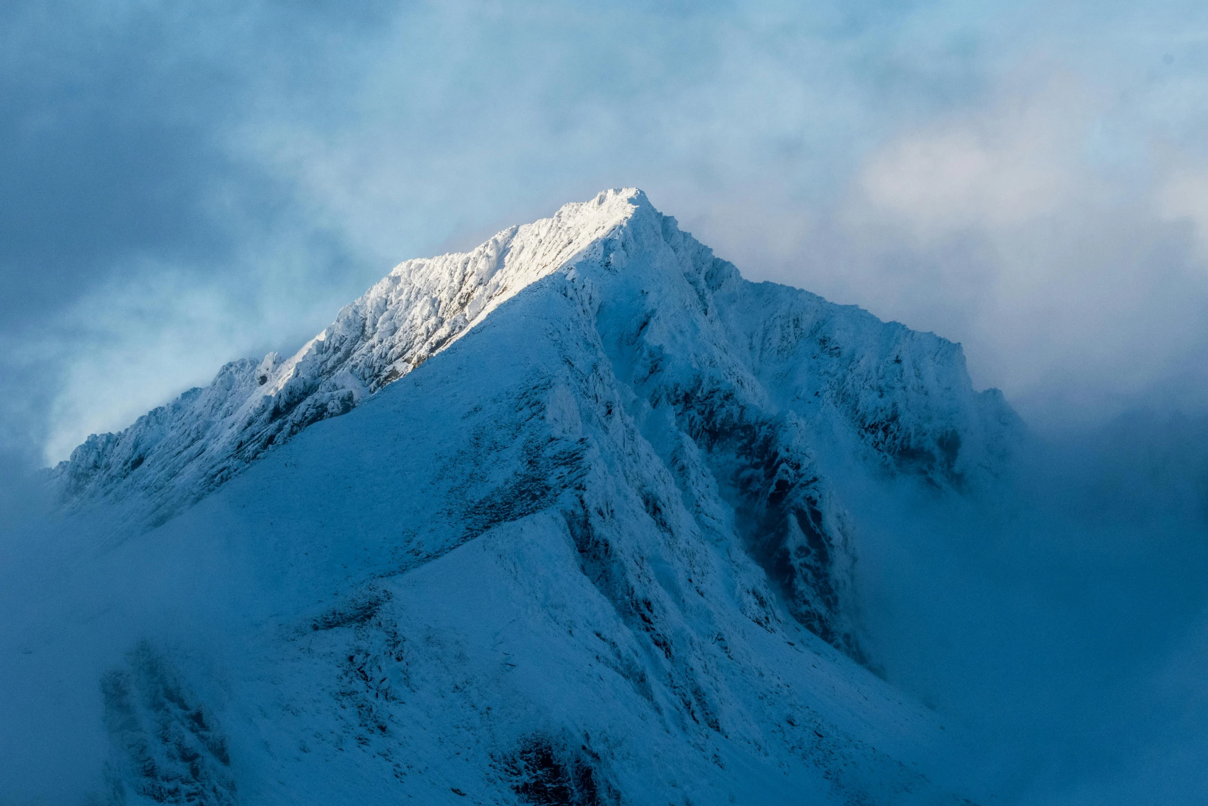 a mountain covered in snow under a cloudy sky, an album cover, unsplash contest winner, baroque, early morning light, a daub of cold blue, new zealand, steep