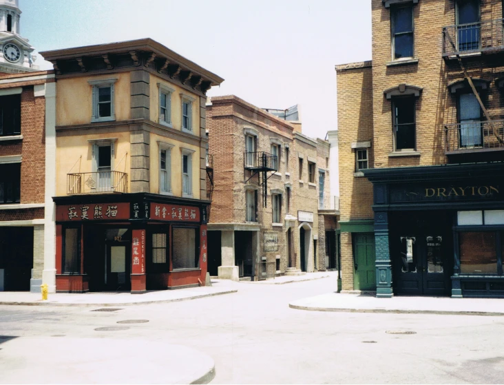 a city street with buildings and a clock tower, a detailed matte painting, by Morris Kestelman, 1990s photograph, chinatown, tabletop model buildings, pixar”