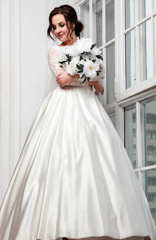 a woman in a wedding dress holding a bouquet, a photo, by Steve Prescott, 15081959 21121991 01012000 4k, voluminous sleeves, a labeled, uk