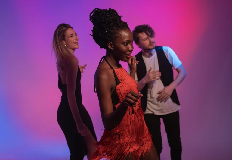 a group of young people standing next to each other, an album cover, pexels contest winner, figuration libre, she is dancing, bright lights, adut akech, performing a music video