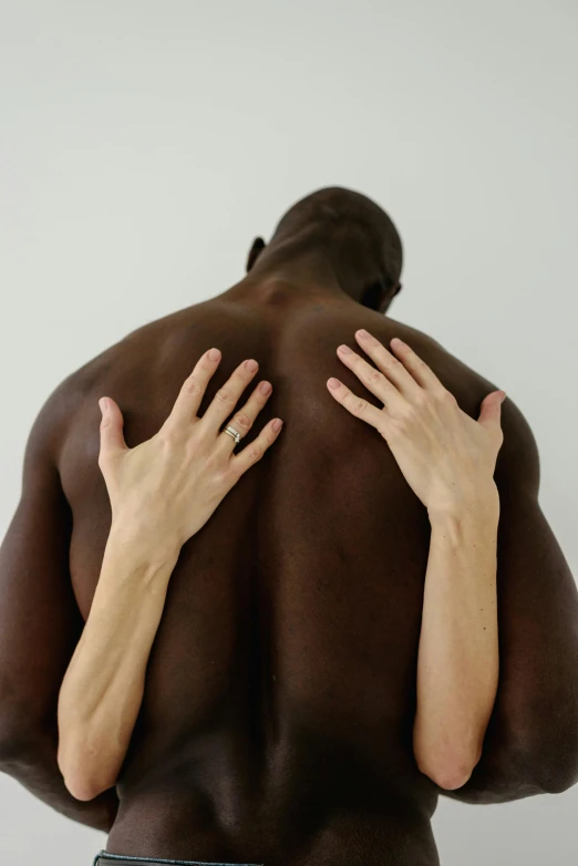 a man with his hands on his back, by Jessie Alexandra Dick, unsplash, lois greenfield, two people, one black, soft skin