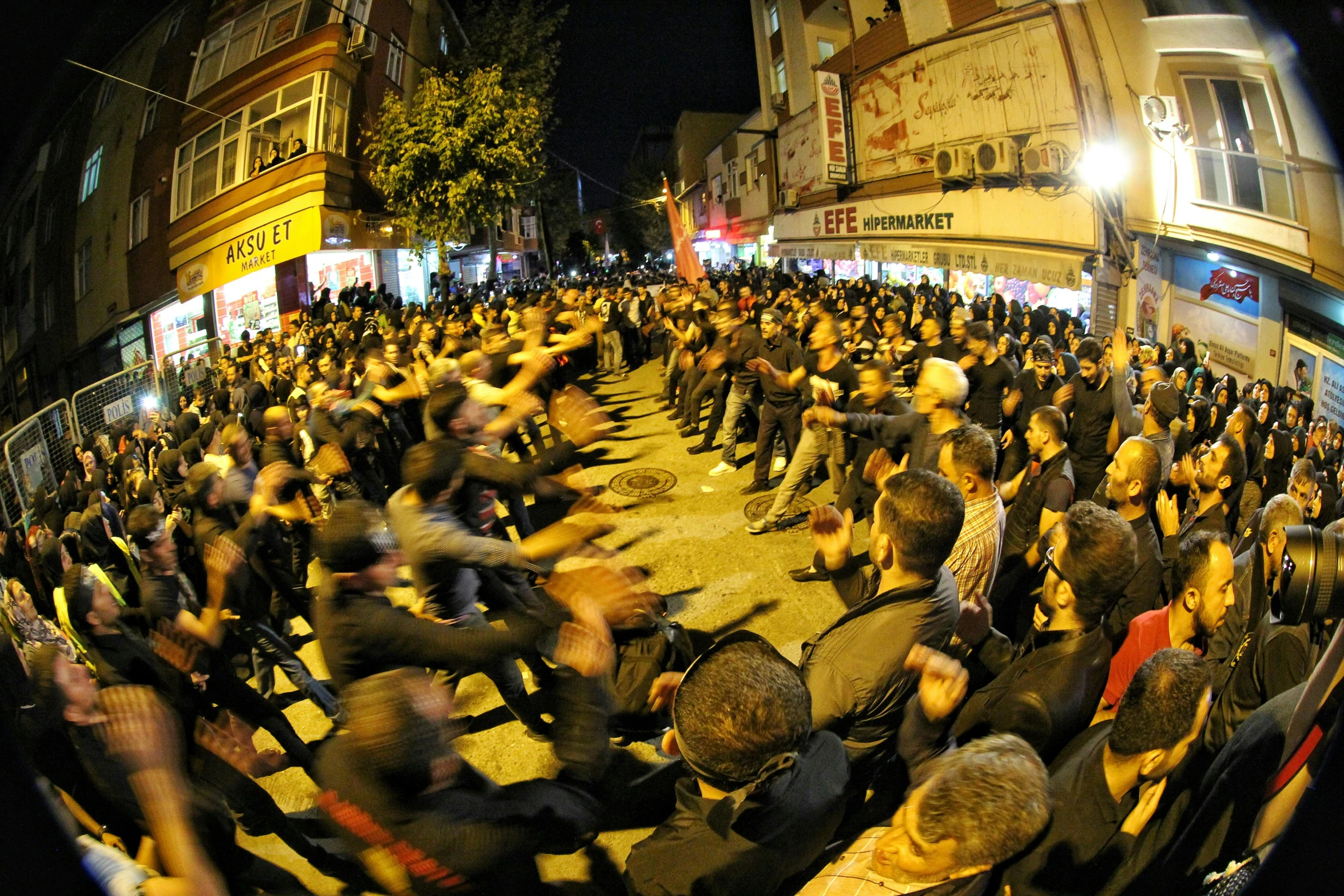 a crowd of people walking down a street at night, an album cover, hurufiyya, people fighting, turkey, slide show, thumbnail