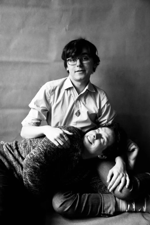 a black and white photo of a man and a woman, an album cover, queer woman, john egbert, ((portrait)), cuddly