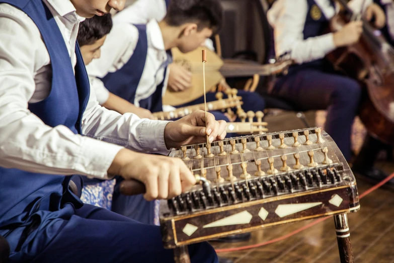 a group of people playing musical instruments in a room, an album cover, pexels contest winner, hurufiyya, orrery, traditional chinese, ash thorp khyzyl saleem, thumbnail