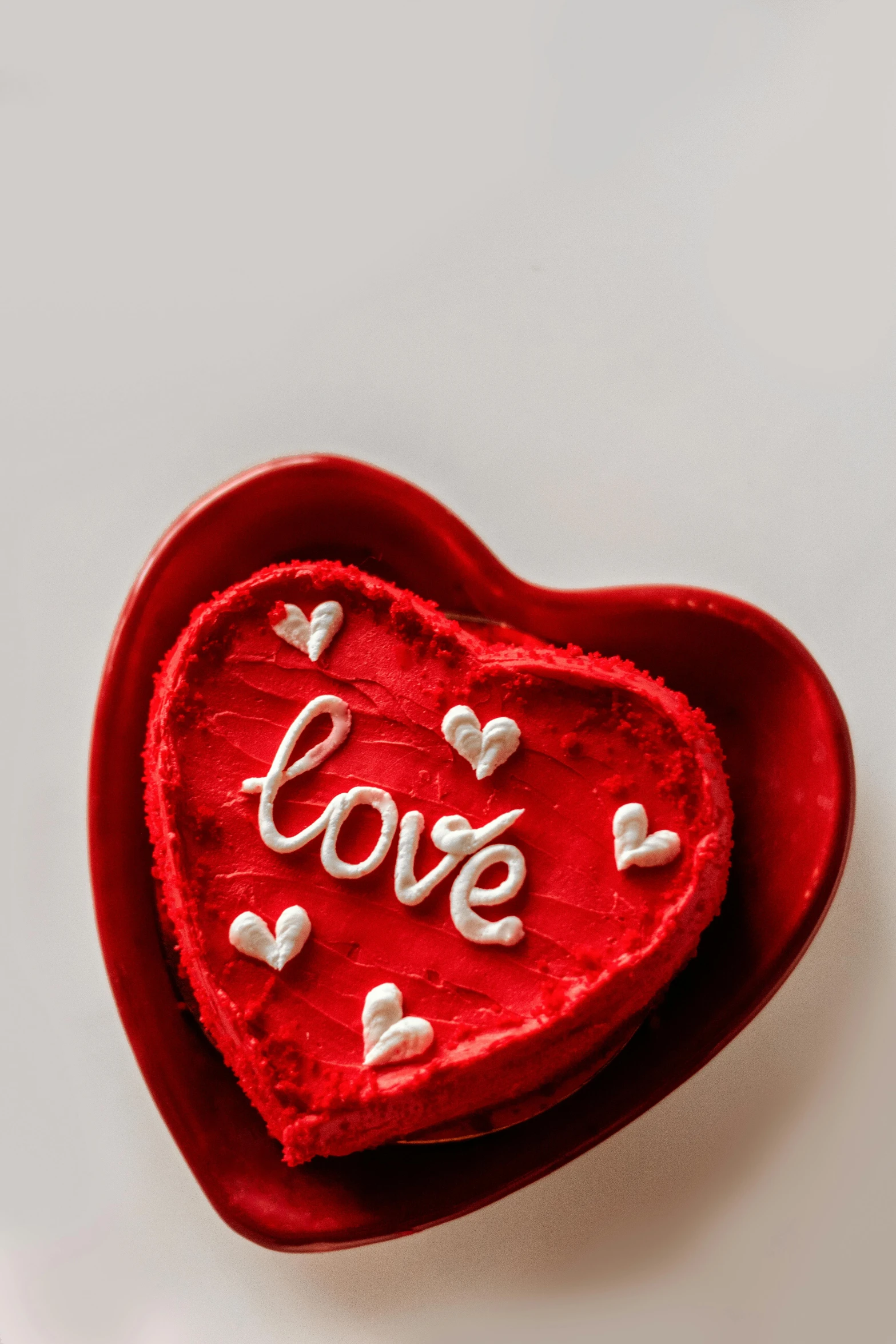 a red heart shaped box with the word love written on it, a picture, pexels, cake, official product photo, small, seasonal