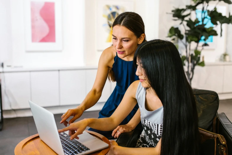 two women sitting at a table with a laptop, pexels contest winner, teaching, sydney park, avatar image, high quality image