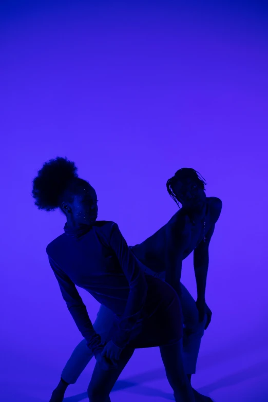 a couple of dancers standing next to each other, unsplash, conceptual art, blue and purle lighting, calarts, ashteroth, showstudio