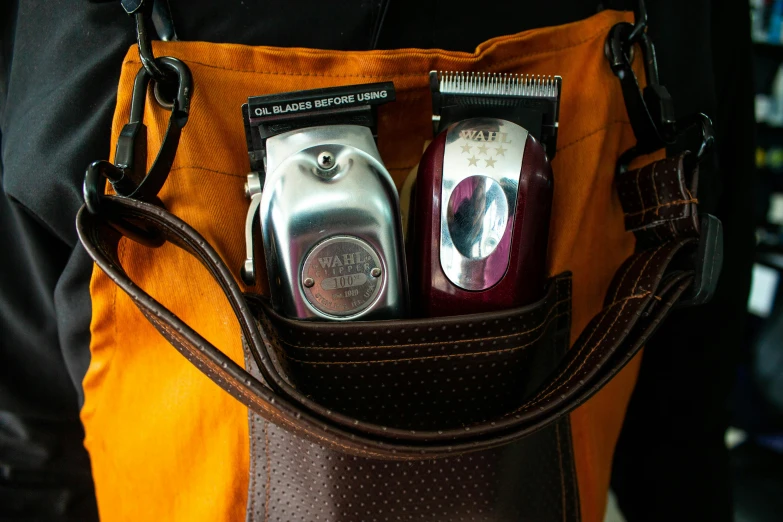 a close up of a person holding a bag with two cell phones in it, chrome bob haircut, flasks, brown, payne's grey and venetian red