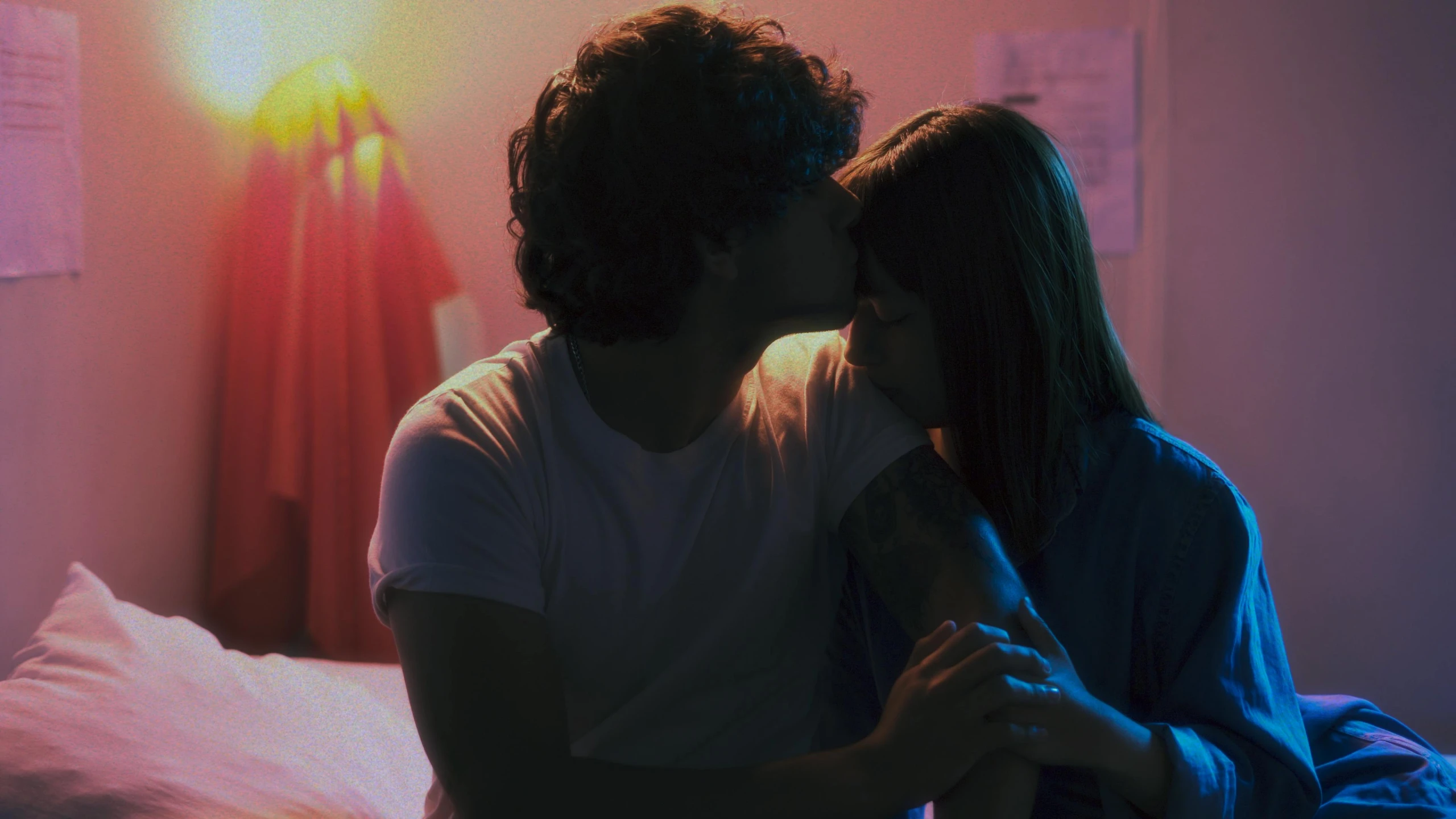 a man and a woman kissing on a bed, pexels contest winner, nick silva and ilya kuvshinov, standing in a dimly lit room, hazy, looking her shoulder