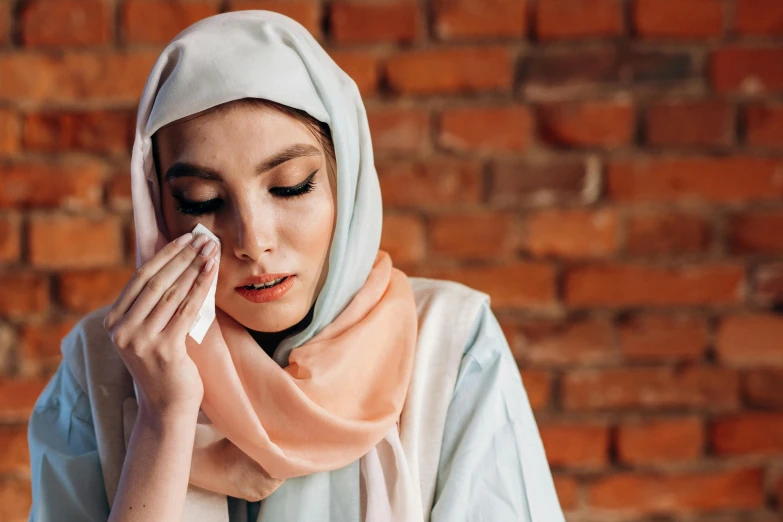 a close up of a person wearing a headscarf, sweat drops, beauty is a virus, facepalm, putting makeup on