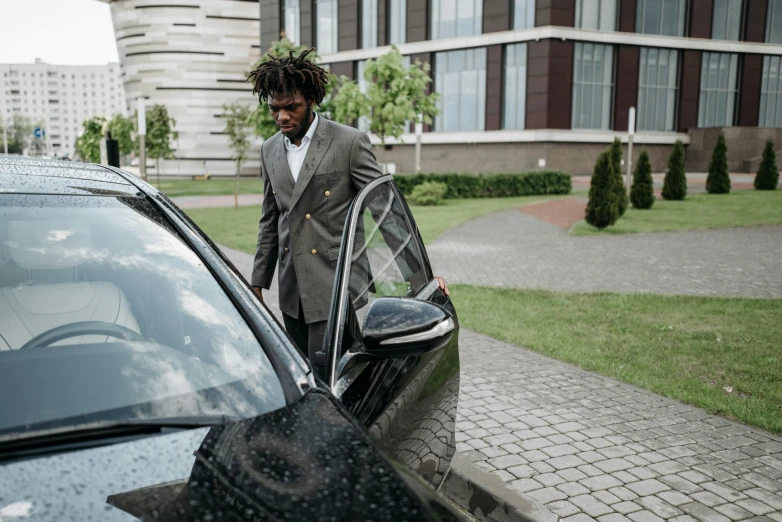 a man in a suit getting out of a car, black man with afro hair, premium quality, uploaded, fan favorite