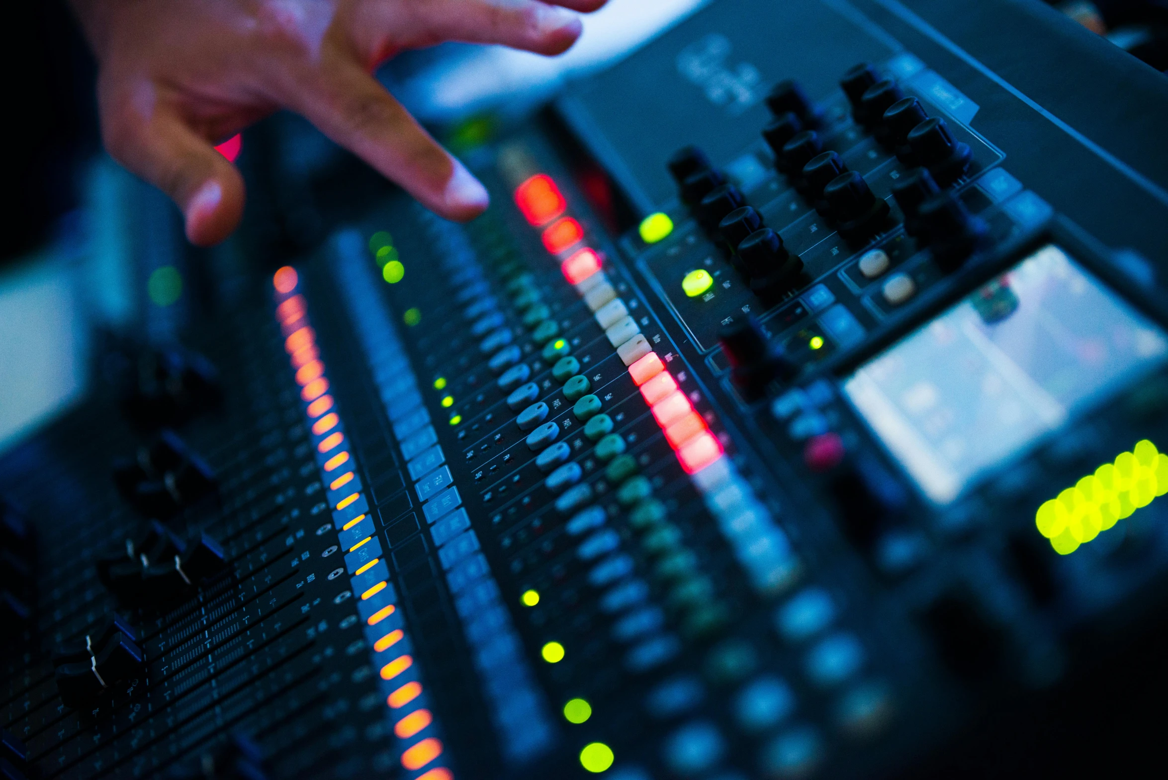 a close up of a person's hand on a sound board, pexels, private press, radio signals, a brightly coloured, engineering, table with microphones