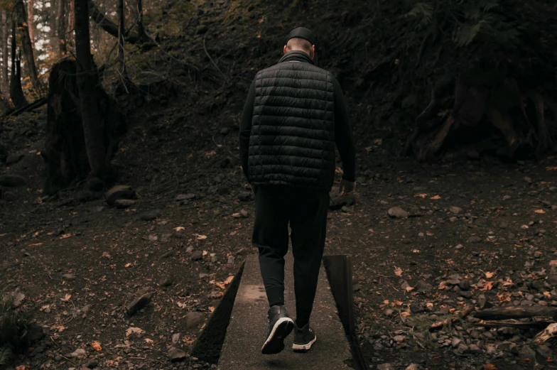 a man walking down a path in the woods, happening, puffer jacket, dark taint :: athletic, profile image, instagram photo