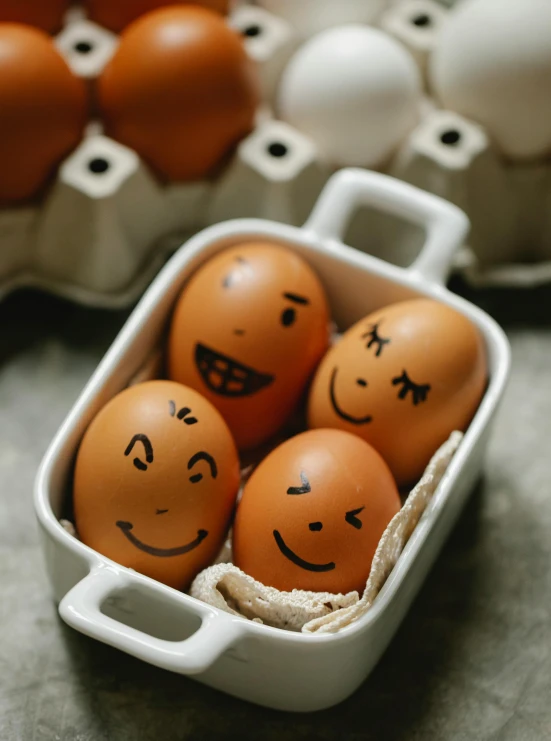 a bunch of eggs with faces drawn on them, a picture, trending on pexels, emote, high quality product image”, portrait image, shot on sony a 7