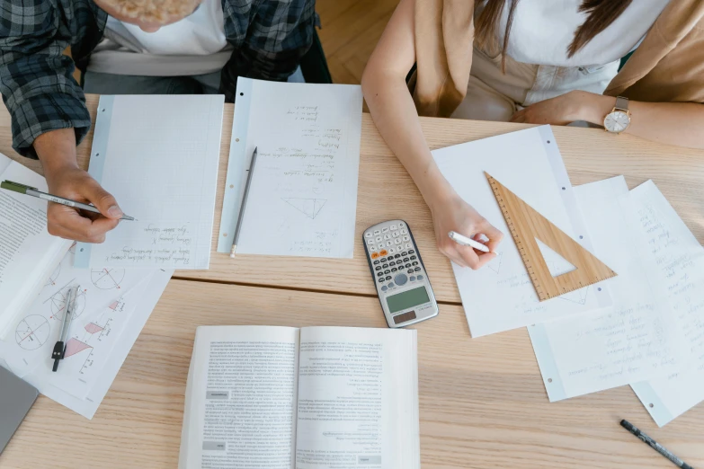 a couple of people that are sitting at a table, pexels contest winner, academic art, algebra, educational supplies, pokimane, reading engineering book