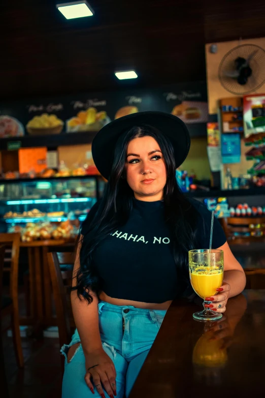 a woman sitting at a bar with a drink, a portrait, pexels contest winner, colombian, anna nikonova aka newmilky, avatar image, 1 6 years old