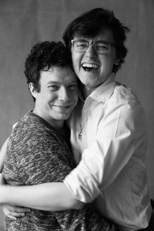 a couple of people that are hugging each other, by Ryan Pancoast, joe keery, ben folds portrait, pose 4 of 1 6, large)}]