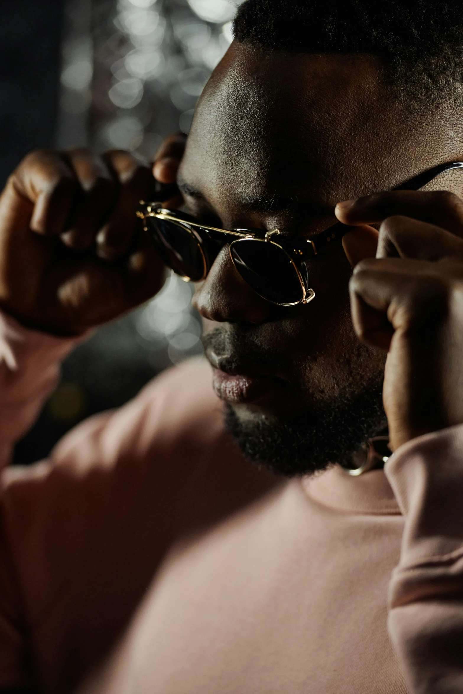 a man wearing sunglasses talking on a cell phone, inspired by Michael Ray Charles, trending on pexels, visual art, dark skinned, looking serious, celebration, with square glasses