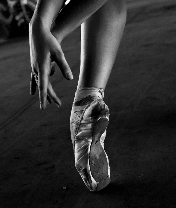 a black and white photo of a ballerina's feet, by Elizabeth Polunin, arabesque, holding close, andrey gordeev, cracked, profile image