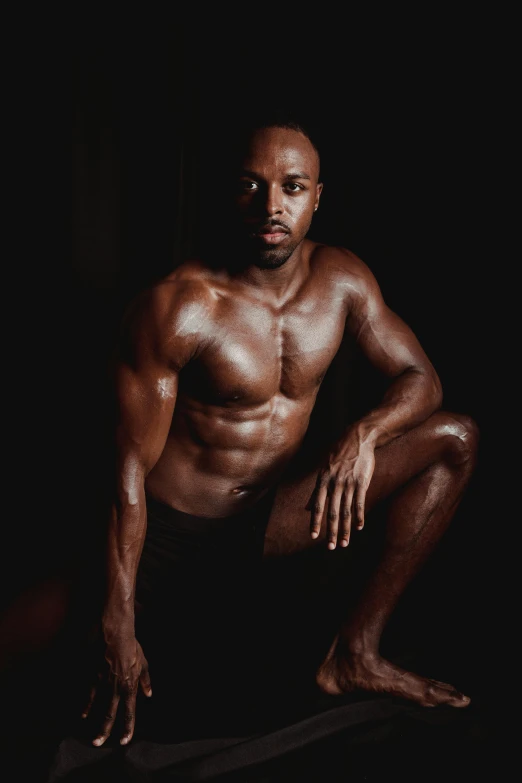 a man posing for a picture in the dark, by Jessie Alexandra Dick, lean and toned, atiba jefferson, sweaty and dirty, studio photo