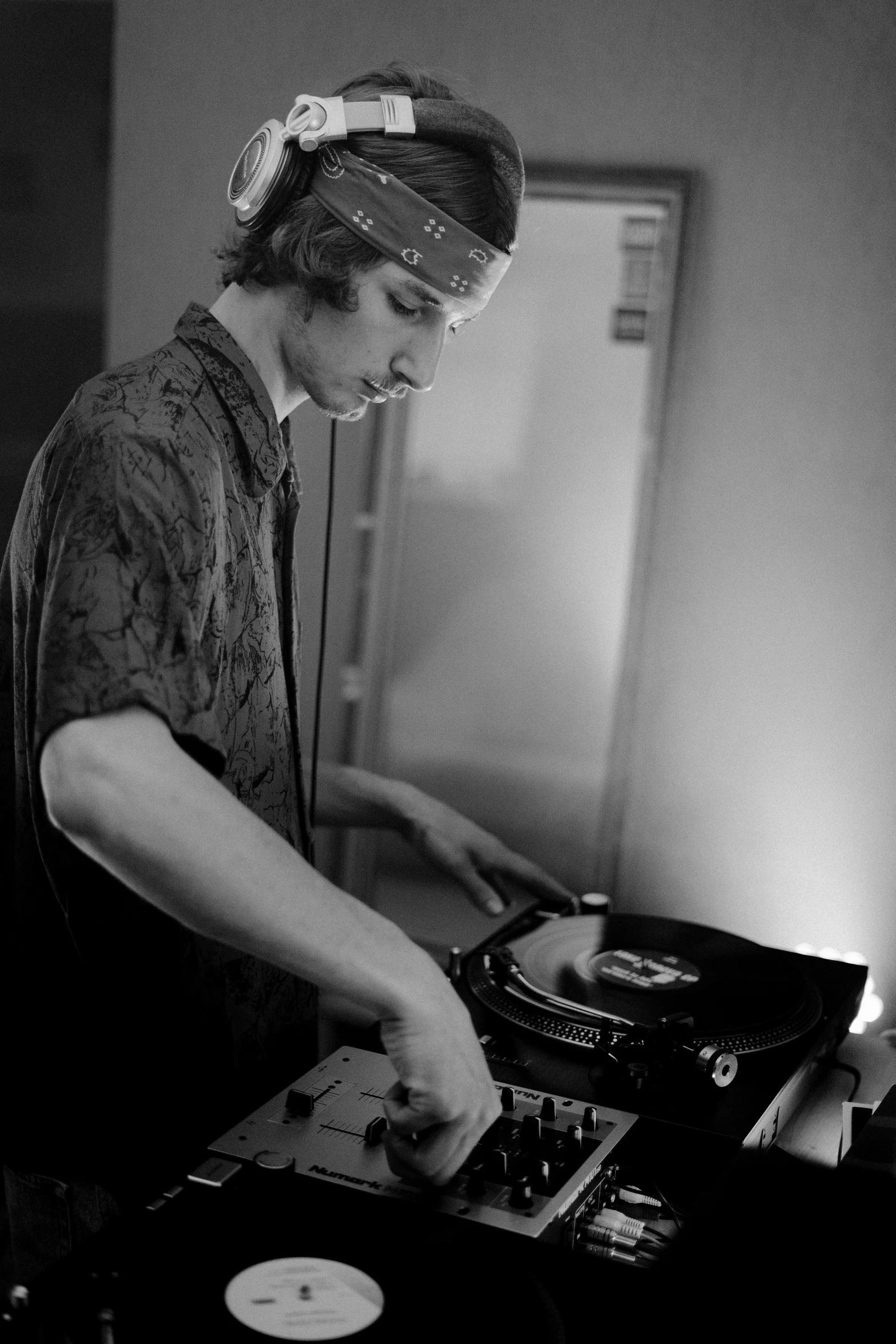 a man that is playing some kind of music, a black and white photo, turntablist, max dennison, xqc, profile image