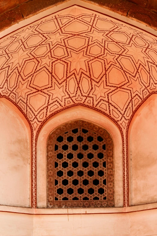 a close up of a window in a building, inspired by Alberto Morrocco, arabesque, rounded roof, inside a tomb, red building, intricate patterns on face