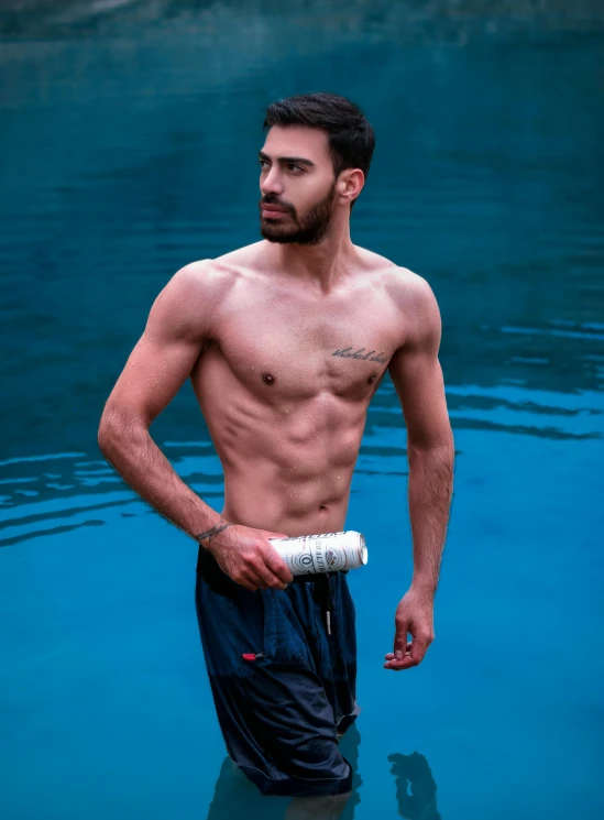 a shirtless man standing in a body of water, by Ismail Acar, holding a bottle of arak, male calisthenics, profile image, fit pic