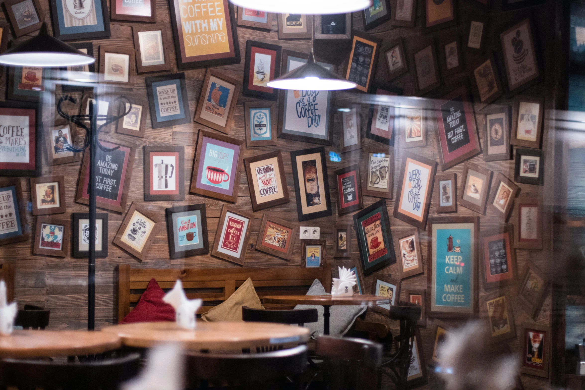 a restaurant with a lot of pictures on the wall, pexels contest winner, coffee, wooden walls with framed art, 9 9 designs, 15081959 21121991 01012000 4k