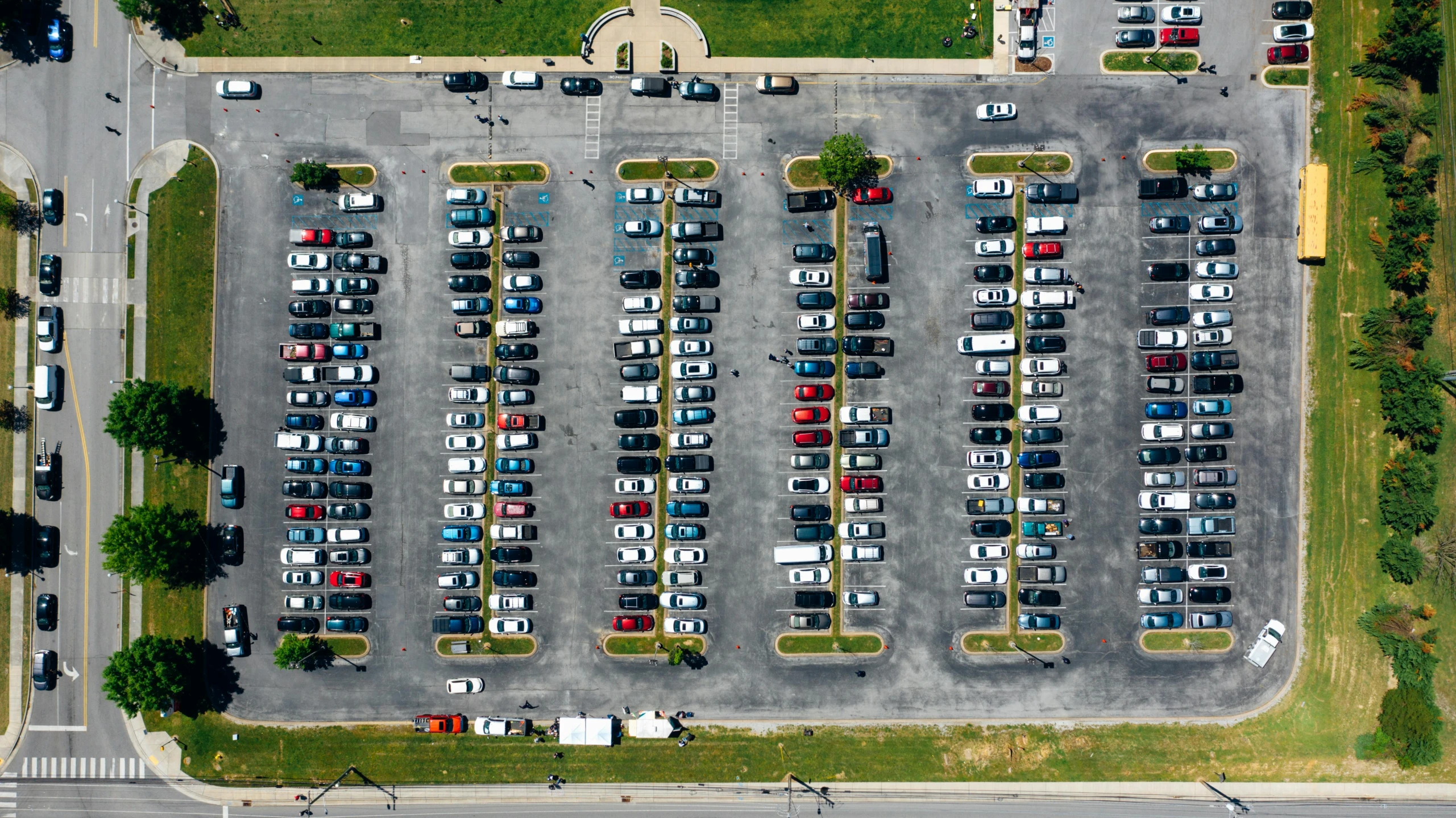 a parking lot filled with lots of parked cars, by Carey Morris, pexels contest winner, renaissance, drone photo, square, plain background, hi resolution