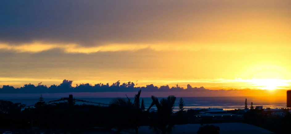 a view of the sun setting over the ocean, by Daniel Lieske, pexels contest winner, happening, reunion island, panorama view of the sky, yellow sky, slide show