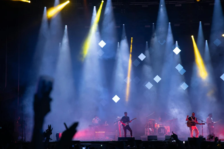 a group of people standing on top of a stage, a picture, pexels contest winner, figuration libre, flashing concert lights, playing guitar onstage, avatar image, light haze