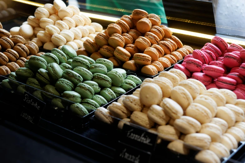 a display case filled with lots of different kinds of macarons, unsplash, 2000s photo, fan favorite, starbucks, french kiss