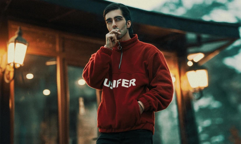 a man in a red hoodie smokes a cigarette, an album cover, inspired by Cafer Bater, unsplash contest winner, half life logo on chest, wearing a turtleneck and jacket, lightroom preset, lucifer